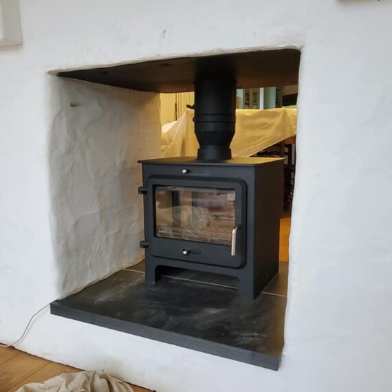 Double-sided wood stove installation